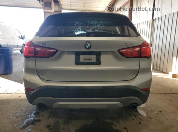 WBXHT3C38H5F79633 2017 BMW X1 Silver Rear view