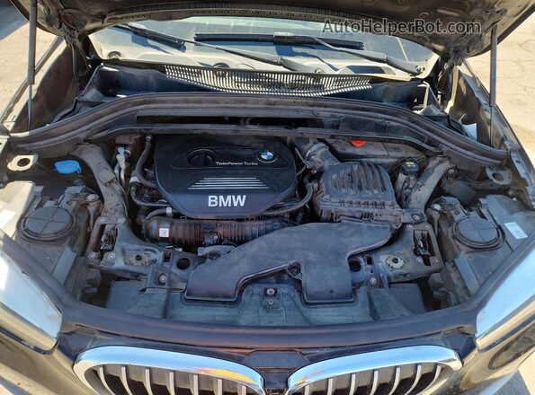 WBXHT3C38J5K28093 2018 BMW X1 Black Vista interior trasera