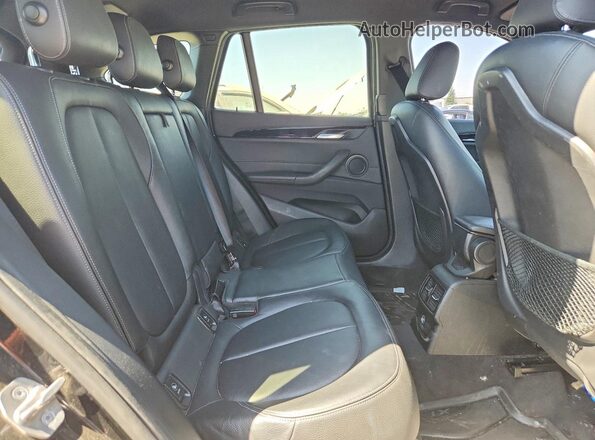 WBXHT3C38J5K28093 2018 BMW X1 Black Vista de los asientos traseros