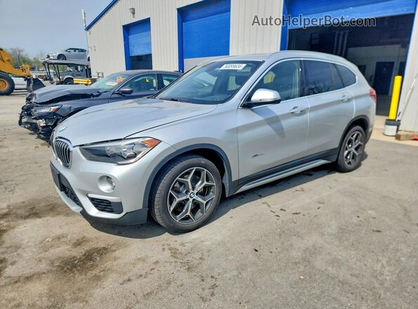 WBXHT3C39GP887460 2016 BMW X1 Серебряный Передняя левая четверть