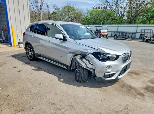 WBXHT3C39GP887460 2016 BMW X1 Серебряный Передняя правая четверть