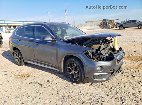 WBXHT3C39H5F85148 2017 BMW X1 Серый Передняя правая четверть