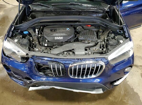 WBXHT3C39J5K29558 2018 BMW X1 Blue Vista del compartimento del motor