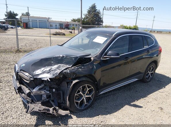 WBXHT3C55K5L89410 2019 BMW X1 Black Vista tres cuartos delantera izquierda