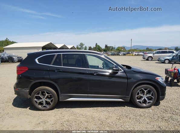 WBXHT3C55K5L89410 2019 BMW X1 Black Vista interior de 360 grados