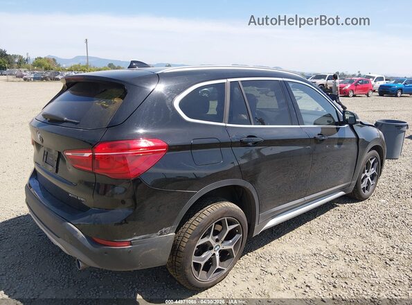 WBXHT3C55K5L89410 2019 BMW X1 Black Trasero derecho