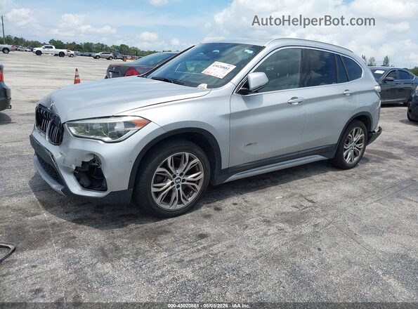 WBXHT3Z39H4A56165 2017 BMW X1 Серебряный Передняя левая четверть