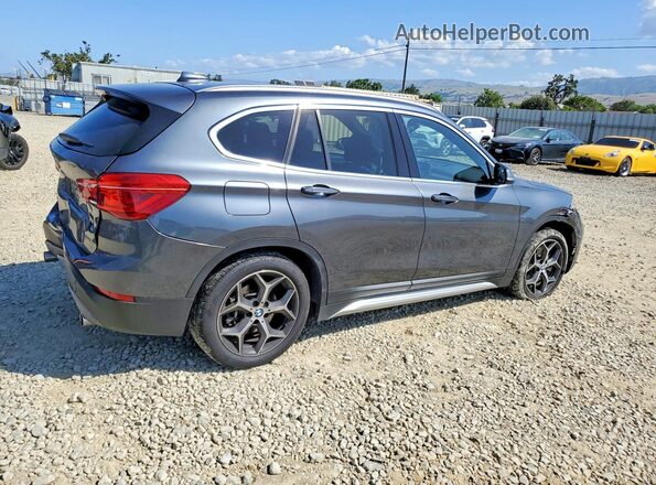 WBXHU7C37J5L09784 2018 BMW X1 Charcoal Trasero derecho
