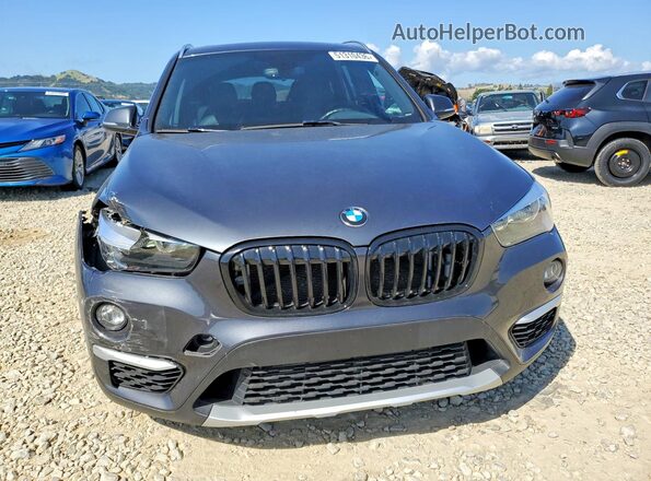WBXHU7C37J5L09784 2018 BMW X1 Charcoal Vista frontal
