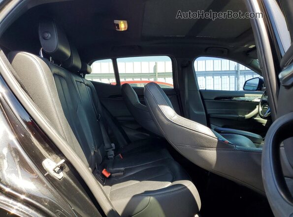 WBXYN1C02L5P41265 2020 BMW X2 Black Vista interior trasera