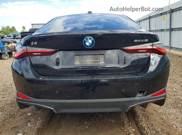 WBY43AW00RFT40375 2024 BMW I4 Black Vista trasera