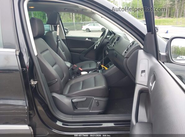 WVGSV7AX0HW508908 2017 VOLKSWAGEN TIGUAN Black Widok wnętrza z przodu