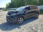 2021 Honda Passport Touring Black vin: 5FNYF8H94MB041046