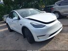 2024 Tesla Model Y Long Range Dual Motor All-wheel Drive White vin: 7SAYGAEE4RF201894