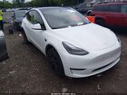 2024 Tesla Model Y Long Range Dual Motor All-wheel Drive White vin: 7SAYGAEE6RF157042