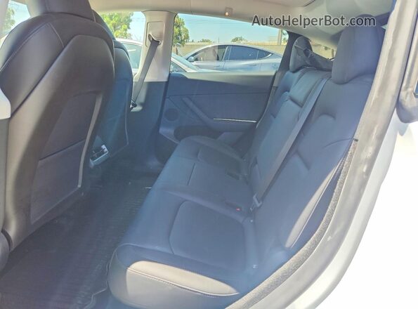 7SAYGDED6RF118878 2024 TESLA MODEL White Rear seats view