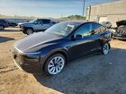 2026 Tesla Model Y Black vin: 7SAYGDEDXTF462267