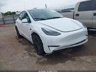 2024 Tesla Model Y Long Range Dual Motor All-wheel Drive White vin: 7SAYGDEE1RA259752