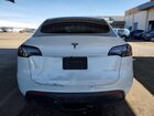 2023 Tesla Model Y White vin: 7SAYGDEE5PF637409 Damage: Lift Gate, Dent(S) W/ Paint Dmg, > 12 Inches