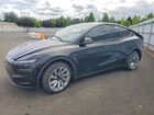 2026 Tesla Model Y Black vin: 7SAYGDEE6TF567123
