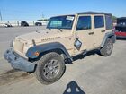 2016 Jeep Wrangler Unlimited Rubicon Tan vin: 1C4BJWFG6GL253670
