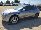 2024 Tesla Model Y Silver vin: 7SAYGDEE0RA288000