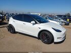 2023 Tesla Model Y Performance Dual Motor All-wheel Drive White vin: 7SAYGDEF7PF804023