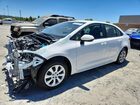2026 Toyota Corolla Hybrid Le White vin: JTDBCMFE2T3148437