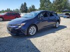 2026 Toyota Corolla Hybrid Le Blue vin: JTDBDMHE9T3033859