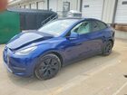 2024 Tesla Model Y Blue vin: 7SAYGAEEXRF202774