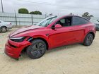 2026 Tesla Model Y Red vin: 7SAYGDED2TF636381