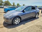 2023 Tesla Model Y Серый vin: 7SAYGDEEXPF909985